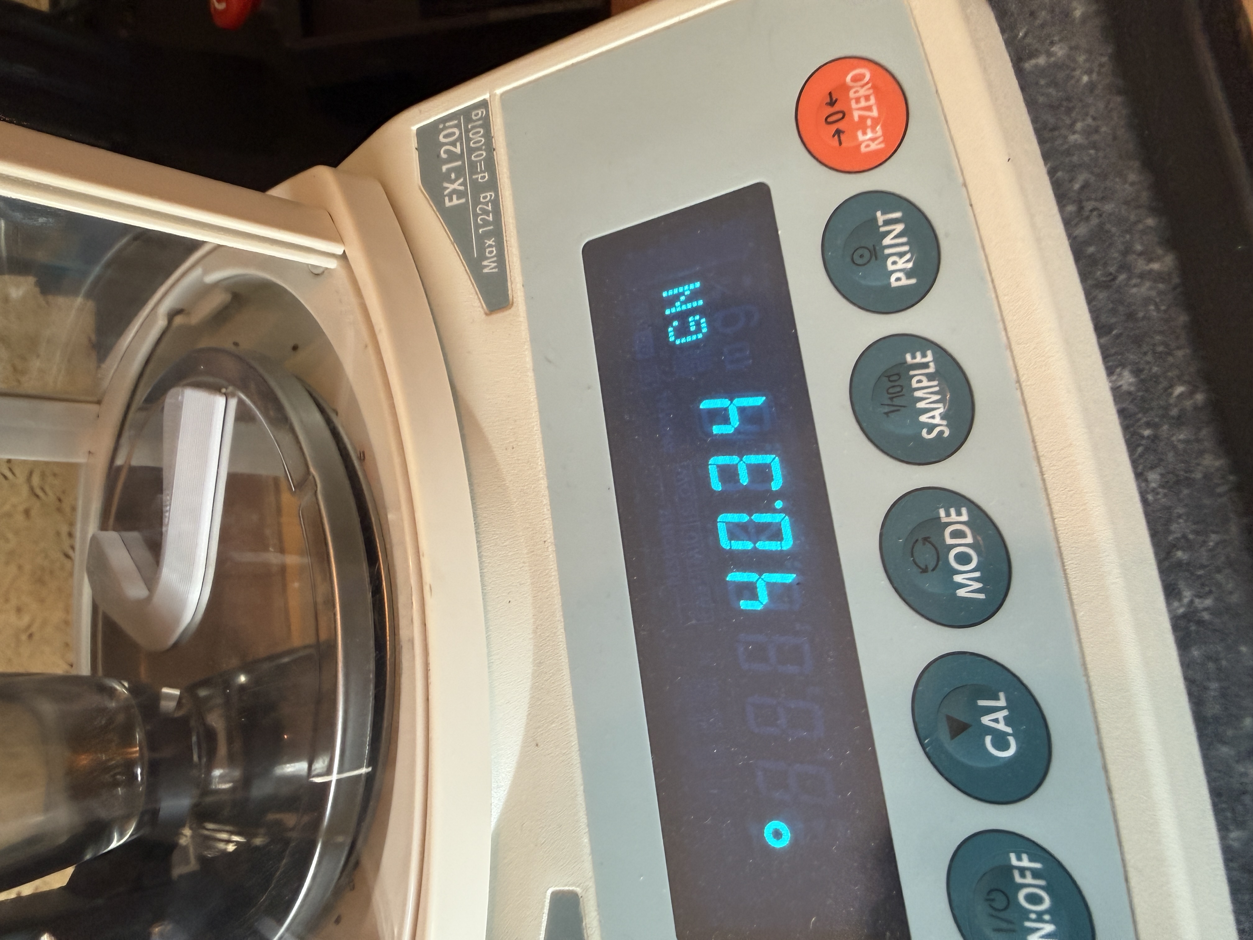 LoadBot precision scale dispensing a charge
